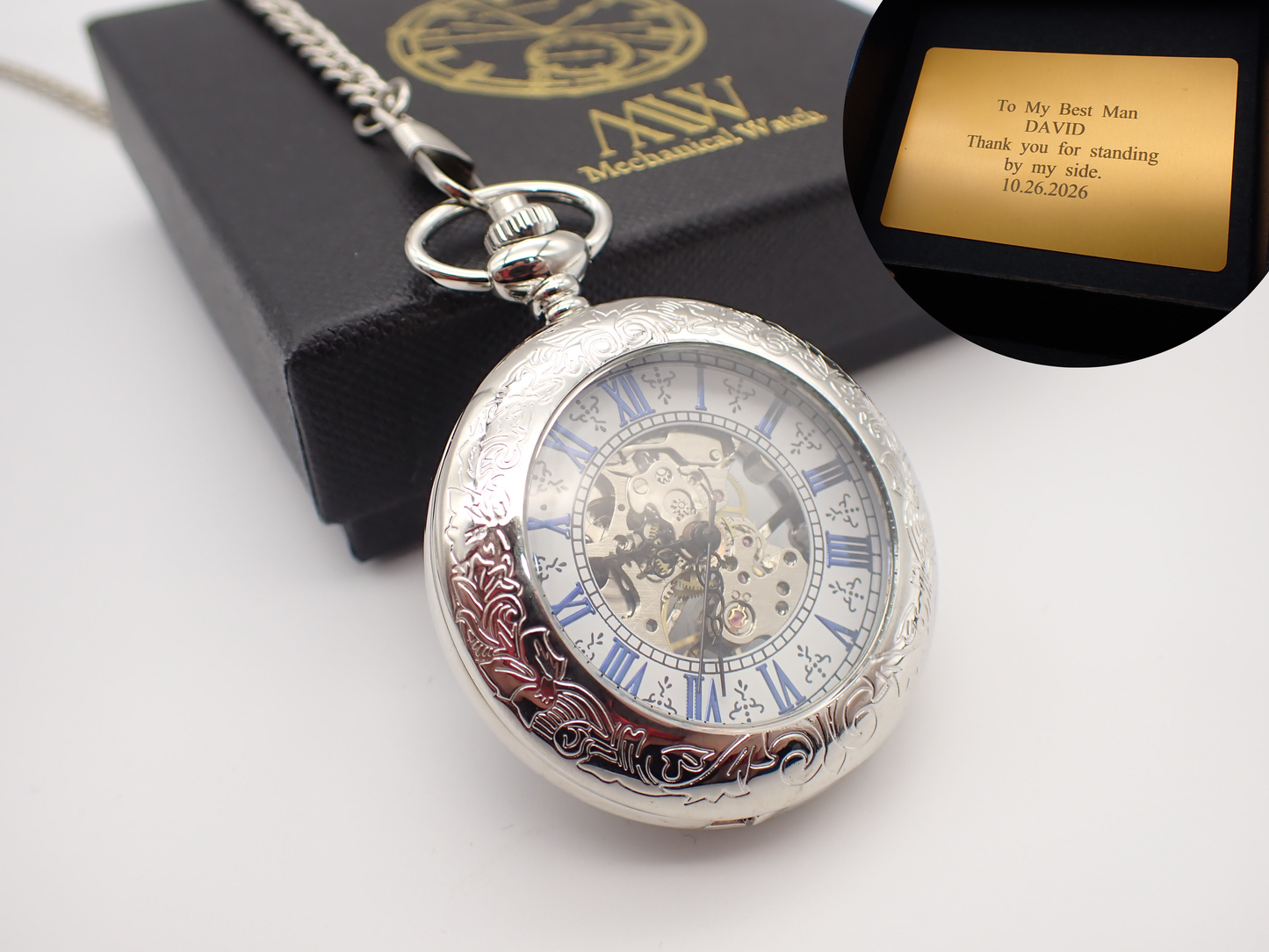 Silver hand-wind mechanical skeleton pocket watch featuring blue Roman numerals and intricate floral engraving, perfect for groomsmen gifts.