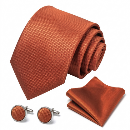 Trendy terracotta rust necktie with a sophisticated woven geometric texture, ideal for rustic wedding themes.